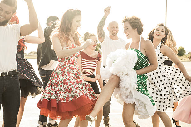 1950s Style People Dancing Outside stock photo