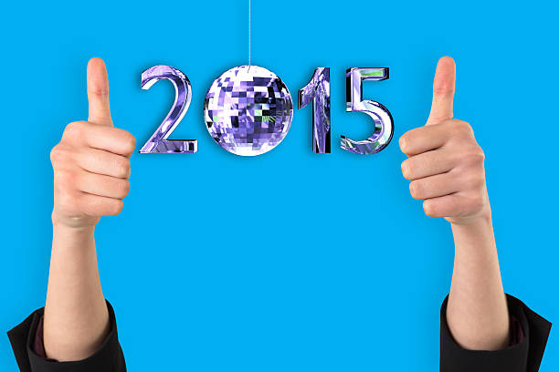 Businesswomans hands showing thumbs up against blue background with vignette