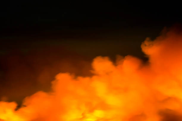 Bushfire, back burning at night in Blue Mountains Australia, flames and smoke over the horizon, full frame horizontal composition with copy space