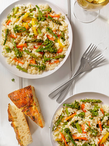 istock Vegetable Risotto with Fresh Parsley and Focaccia Bread 530003440