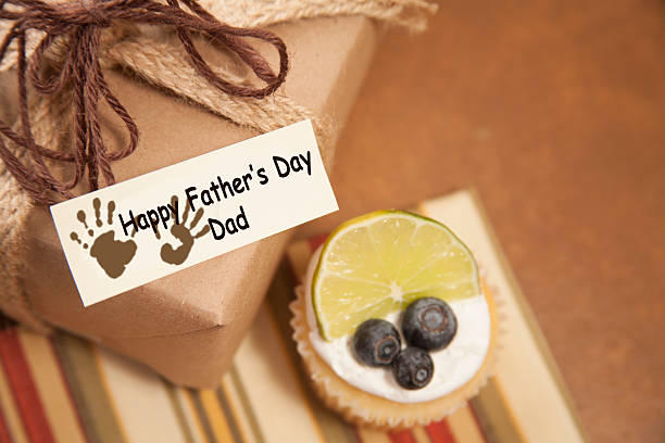 istock Holidays:  Father's Day wrapped gift for dad.  Breakfast muffin. 530004174
