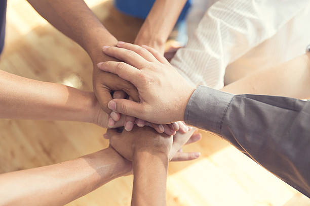 istock united hands for cooperation and teamwork concept 530004226