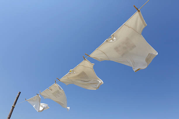 istock White t-shirts hanging to dry 530004342