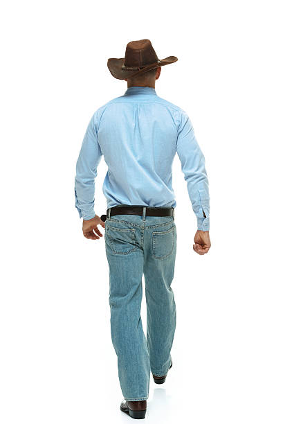 istock Rear view of cowboy waking 530005209