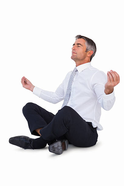 istock Relaxed businessman in lotus pose 530005861