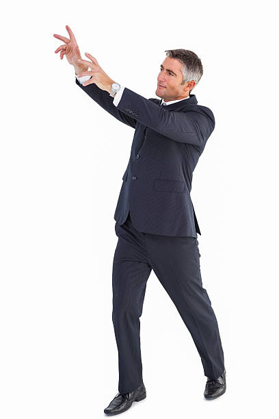 istock Happy businessman standing with arms up 530005993