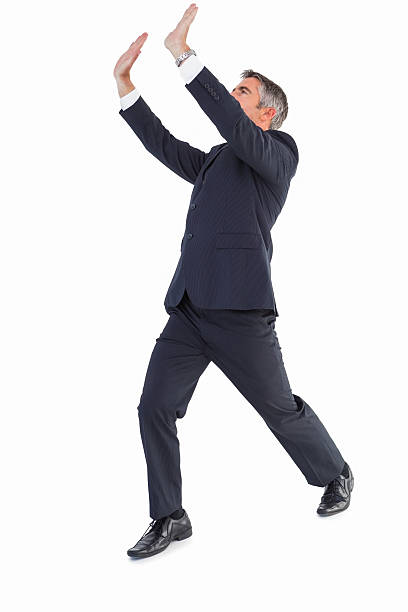 istock Businessman in suit with arms up 530006007