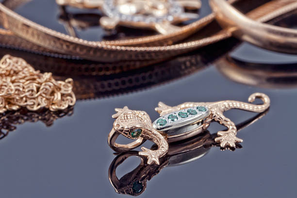 istock Unusual gold pendant in the form of lizard 530006113