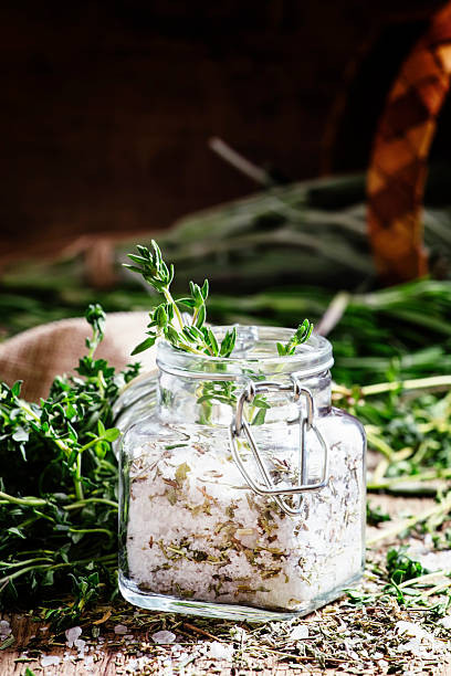 istock Traditional spicy salt with thyme in a glass jar 530006830