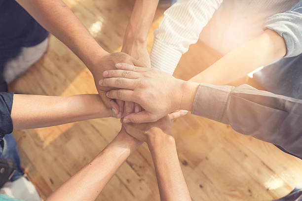 istock united hands for cooperation and teamwork concept 530006874