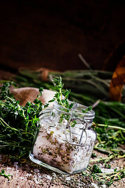 istock Traditional spicy salt with thyme in a glass jar 530006904