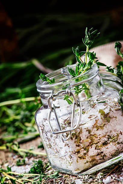 istock Traditional spicy salt with thyme in a glass jar 530006996