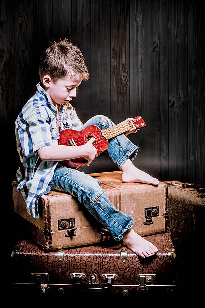 istock Young traveler play ukulele 530007088