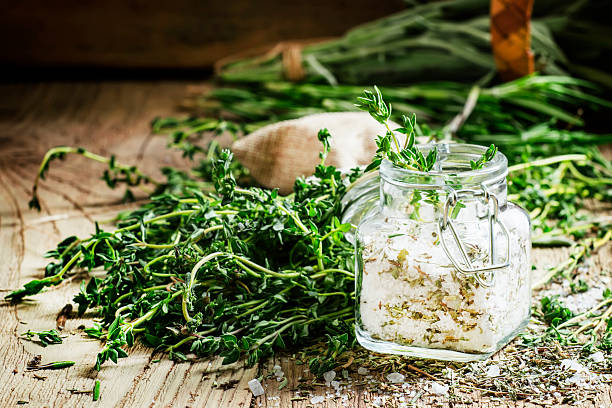 istock Traditional spicy salt with thyme in a glass jar 530007092