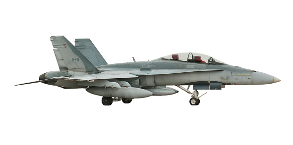 Side view of and Canadian CF-18 hornet fighter jet, also known as a FA-18, isolated on white background with clipping path