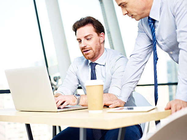 istock corporate people working together on laptop computer 530008058