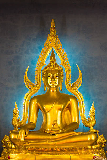 istock Illuminated golden Buddha inside a Thai temple, Bangkok 530009398