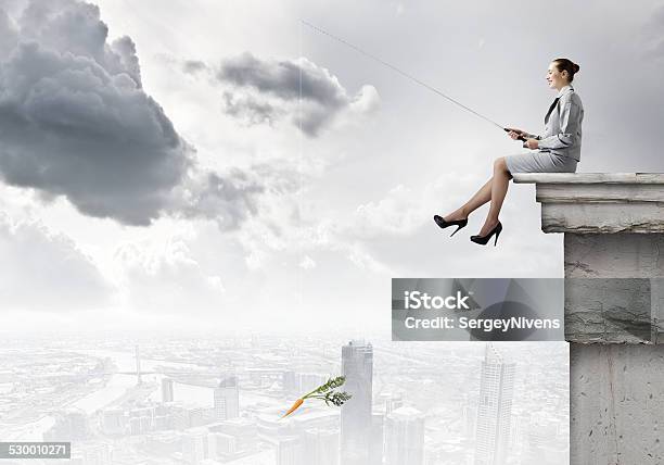 Businesswoman With Rod Stock Photo - Download Image Now - Carrot, Fishing Rod, Adult