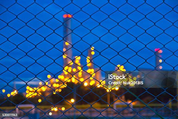 Defocused Building And Lights In Plant In Twilight Time Stock Photo - Download Image Now