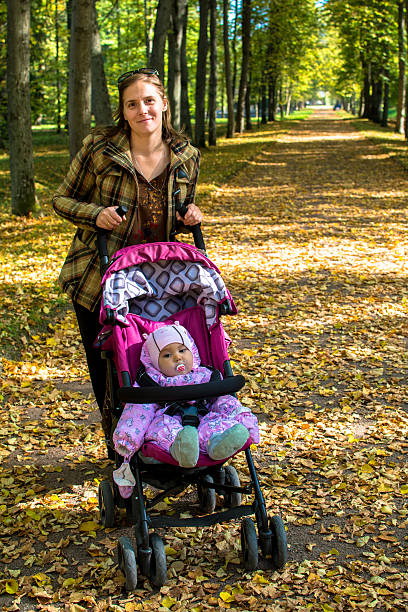istock woman with a baby carriage 530045167