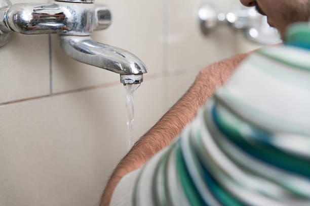 Muslim Man Preparing To Take Ablution In Mosque