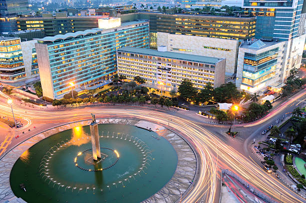 Hotel Indonesia Jakarta Landmark Roundabout, Indonesia Jakarta is capital city of Indonesia. It has an amazing landmark at the center of town. They called it Patung Selamat Datang (Welcome Statue) located at Bundaran Hotel Indonesia. jakarta skyline stock pictures, royalty-free photos & images