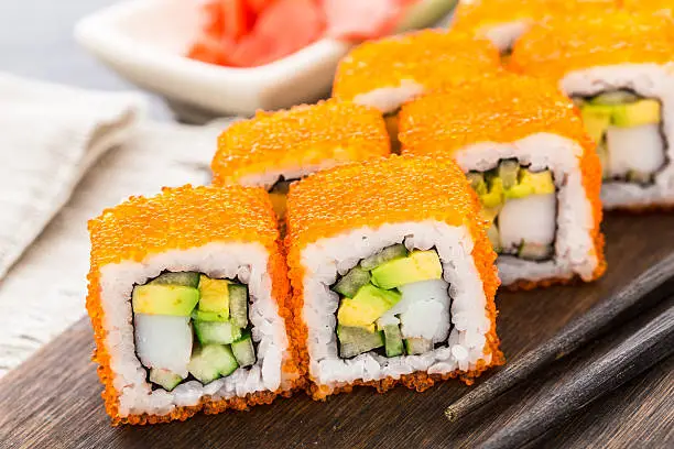 Photo of Sushi roll with tobico and avocado