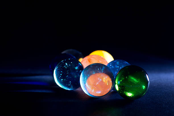 istock Shiny Colorful Translucent Glass Balls Against Black Background 530049207