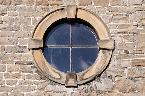 Round window with stone frame detail.