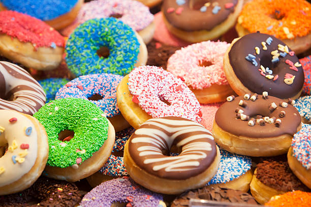 Donuts Colorful donuts with different decorations doughnut stock pictures, royalty-free photos & images