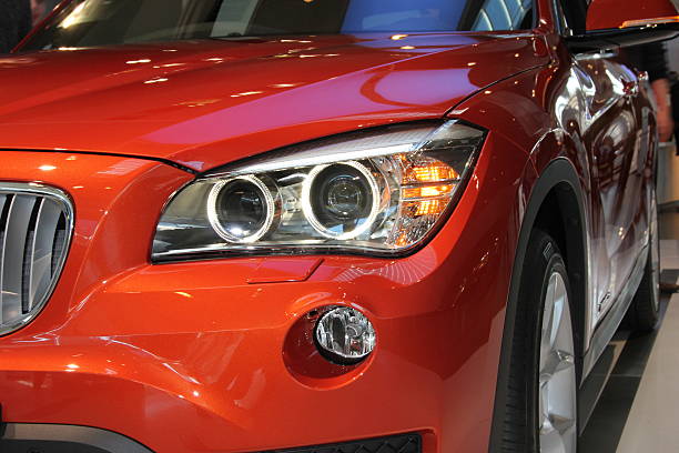Munich, Germany - February 15, 2014: Headlights of a BMW. The photo was taken at Munich Airport.