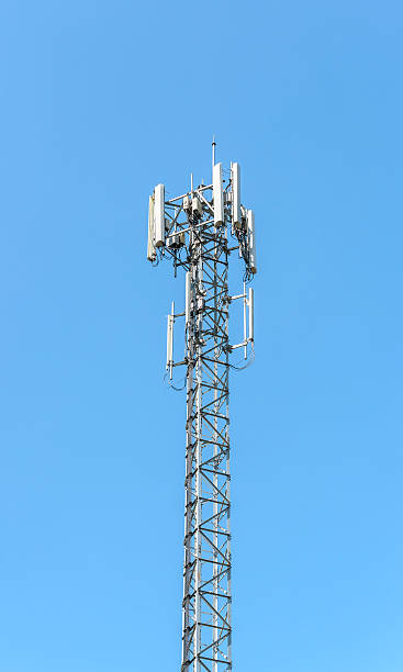 istock Antennas of cellular systems with blue sky 530084111