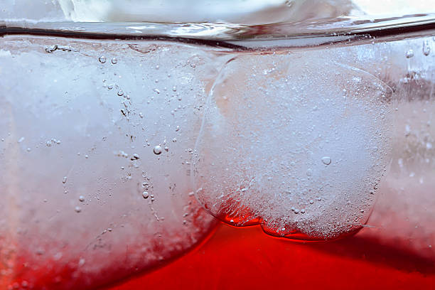 istock red beverage with ice in glass for  abstrack background 530084825