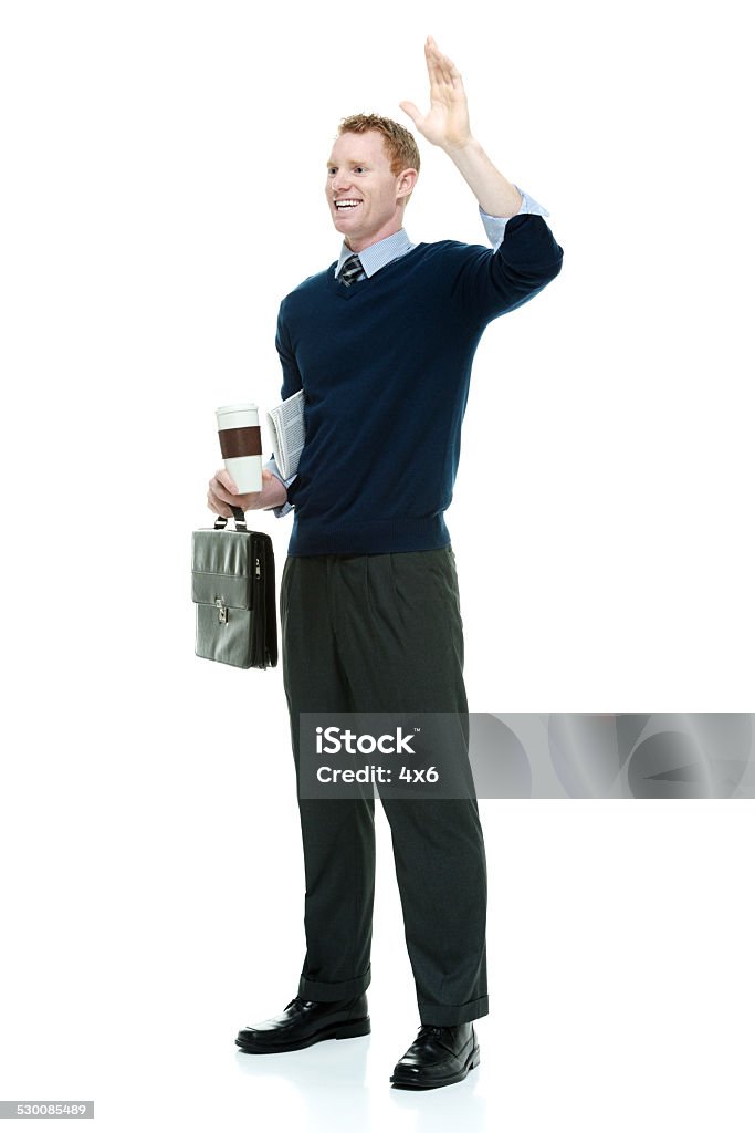 Happy businessman holding coffee cup & waving hand Happy businessman holding coffee cup & waving handhttp://www.twodozendesign.info/i/1.png 20-29 Years Stock Photo