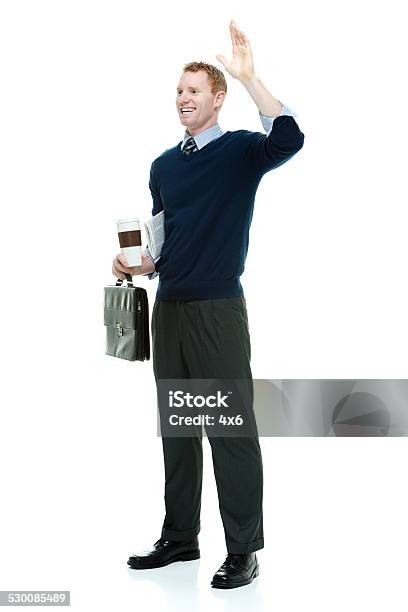 Happy Businessman Holding Coffee Cup Waving Hand Stock Photo - Download Image Now - 20-29 Years, 25-29 Years, Adult
