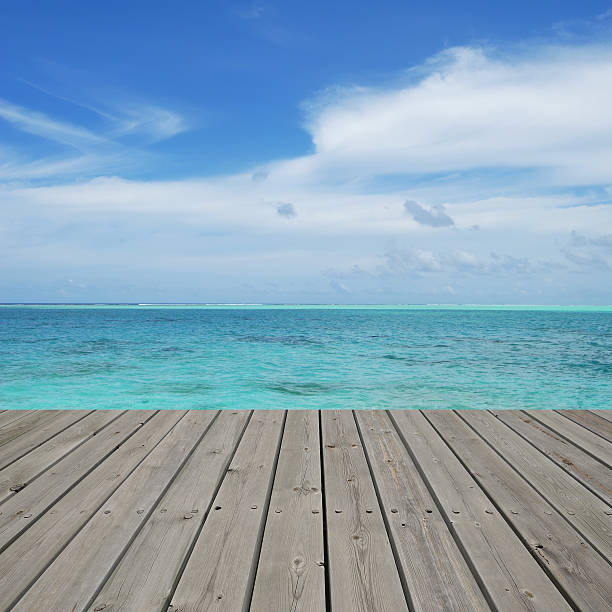 istock Wooden platform beside tropical sea 530086145