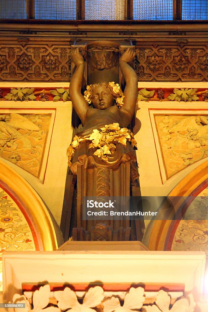 Caryatid and Gold The ornate Ferstel passage, a covered walkway, in Vienna.  Ancient Stock Photo