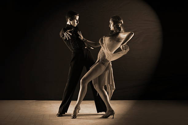 istock Latino dancers in ballroom isolated on black background 530086559