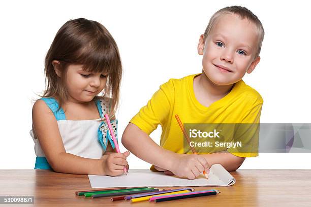 Children Draws At The Desk Stock Photo - Download Image Now - Blond Hair, Boys, Cheerful