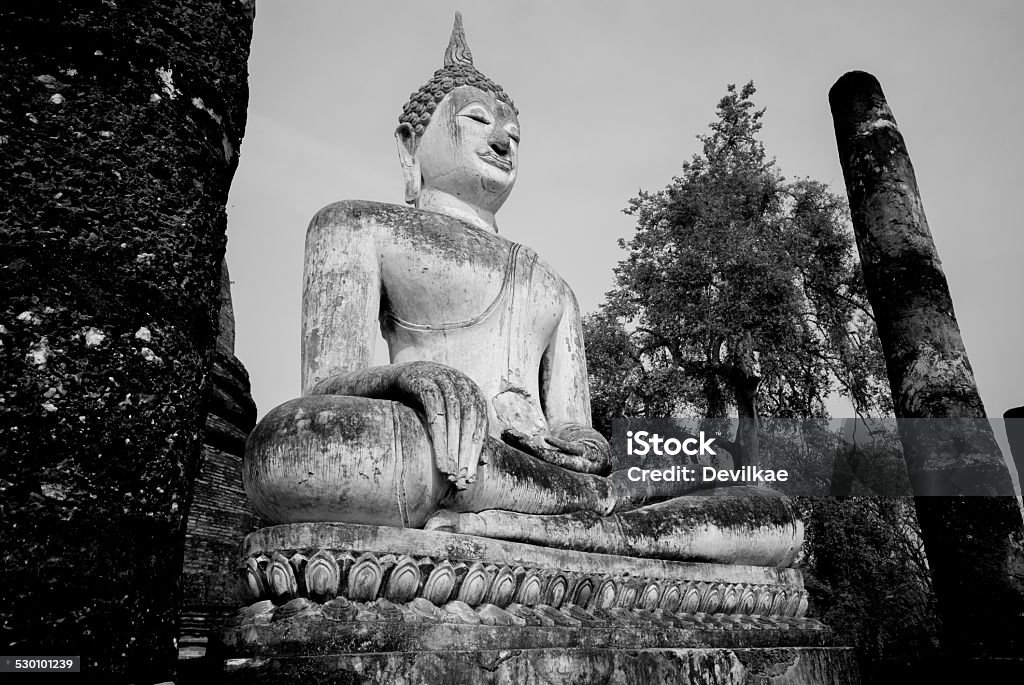 Black and White Buddha statue Sukhothai, Thailand Ancient Stock Photo