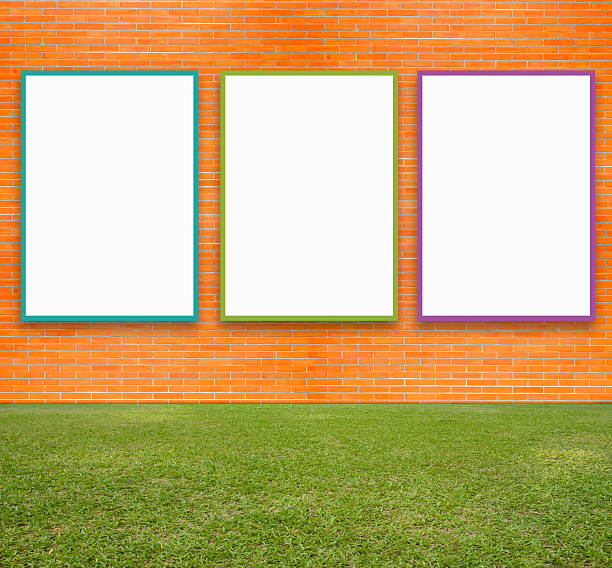 istock Blank Poster with brick wall and green lawn 530102439