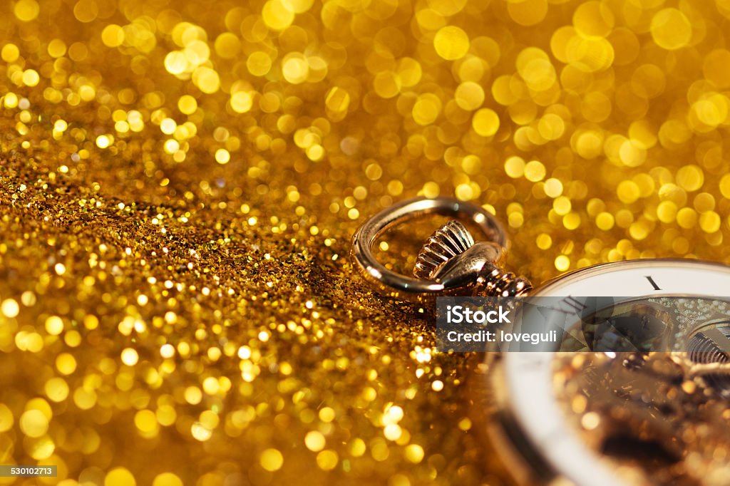 pocket watch on the gold sand background to describe concept  time is money Accessibility Stock Photo