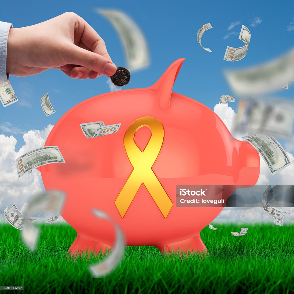 charity fund for AIDS concept hand insert piggy bank with AIDS fund icon on meadow and skyline background AIDS Stock Photo