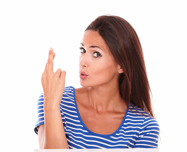 istock Pretty lady in blue t-shirt making a lucky sign 530103493