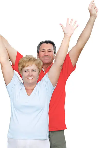 Elderly couple with hands-up. Isolated over white