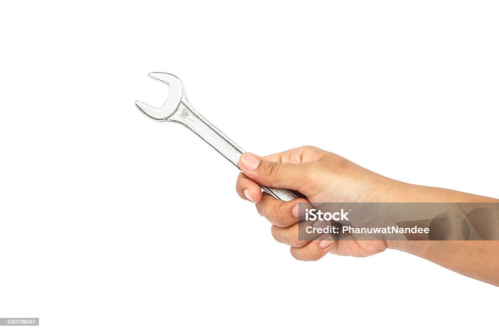 Hand holding wrench isolated on white background Adult Stock Photo