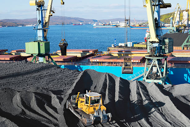 istock Mountains of coal in the port. 530118191