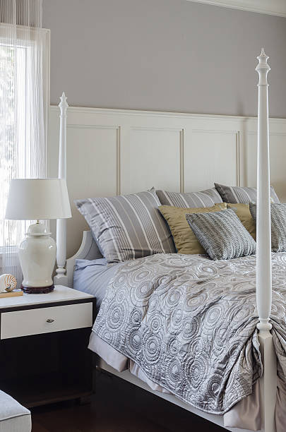 istock luxury king size bed with white lamp 530119593