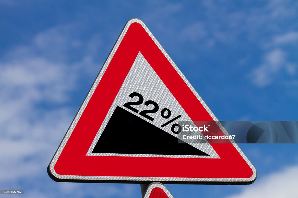 Steep hill warning Signpost Steep hill warning signpost on Sky background Advice Stock Photo