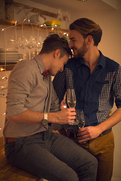 istock Loving gay couple drinking champagne. 530157407